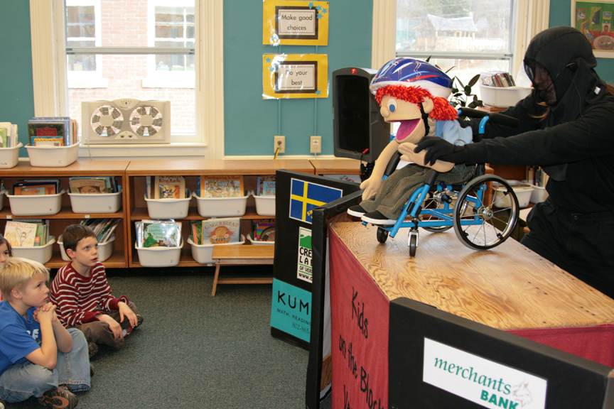Puppet Mark Riley on stage for a Puppets in Education performance.