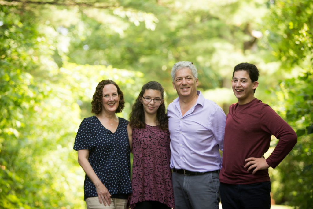 Family portrait with woods in background