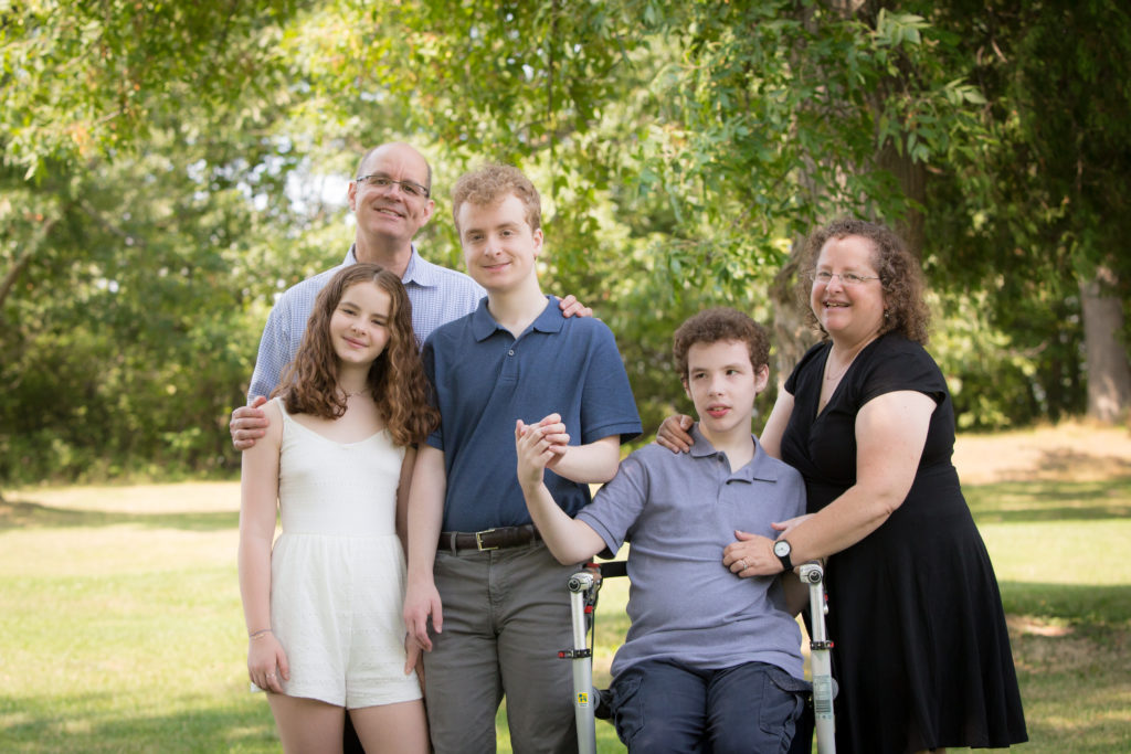 Family portrait with trees in background