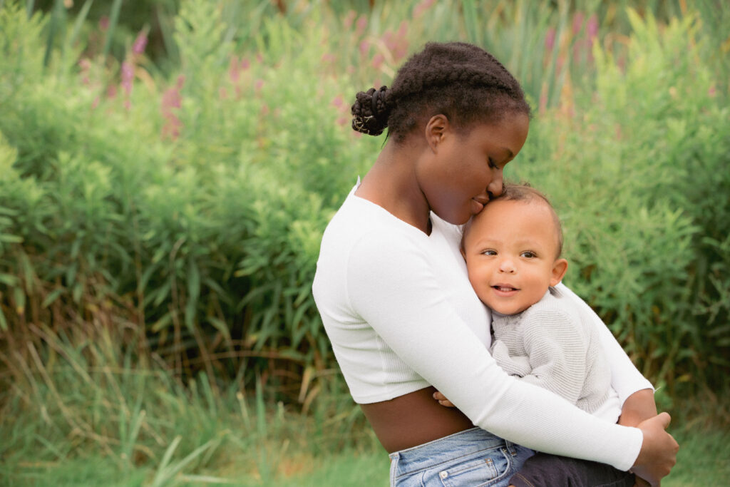 A women holding a baby.